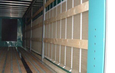 Interior of truck fitted with Serge Ferrari Defender security mesh panels, showing reinforced anti-vandal lining for cargo protection.