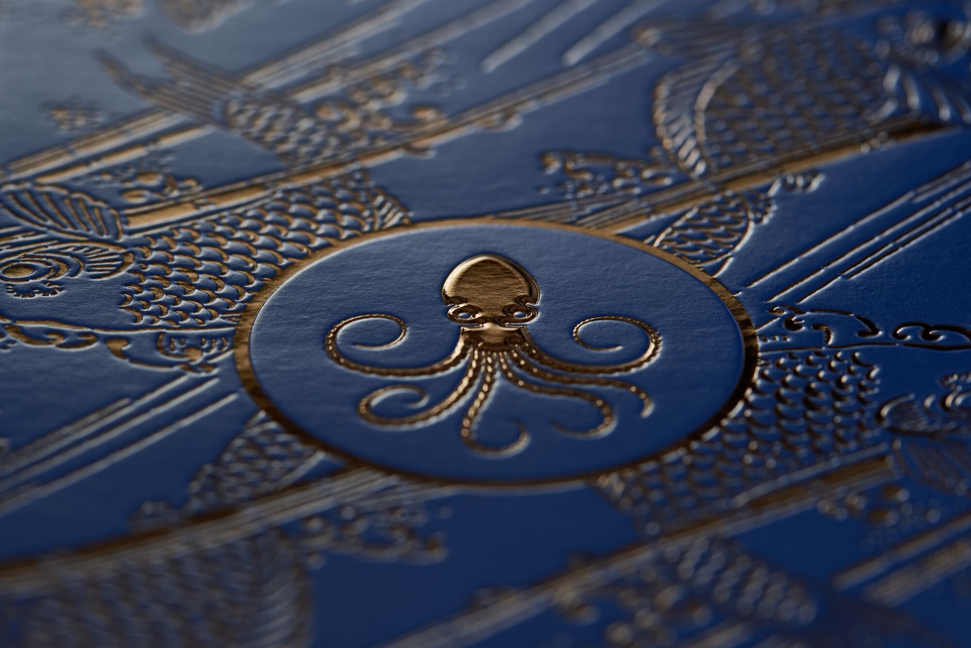 High-gloss gold hot stamping on dispersion-varnished surface with clean edge definition