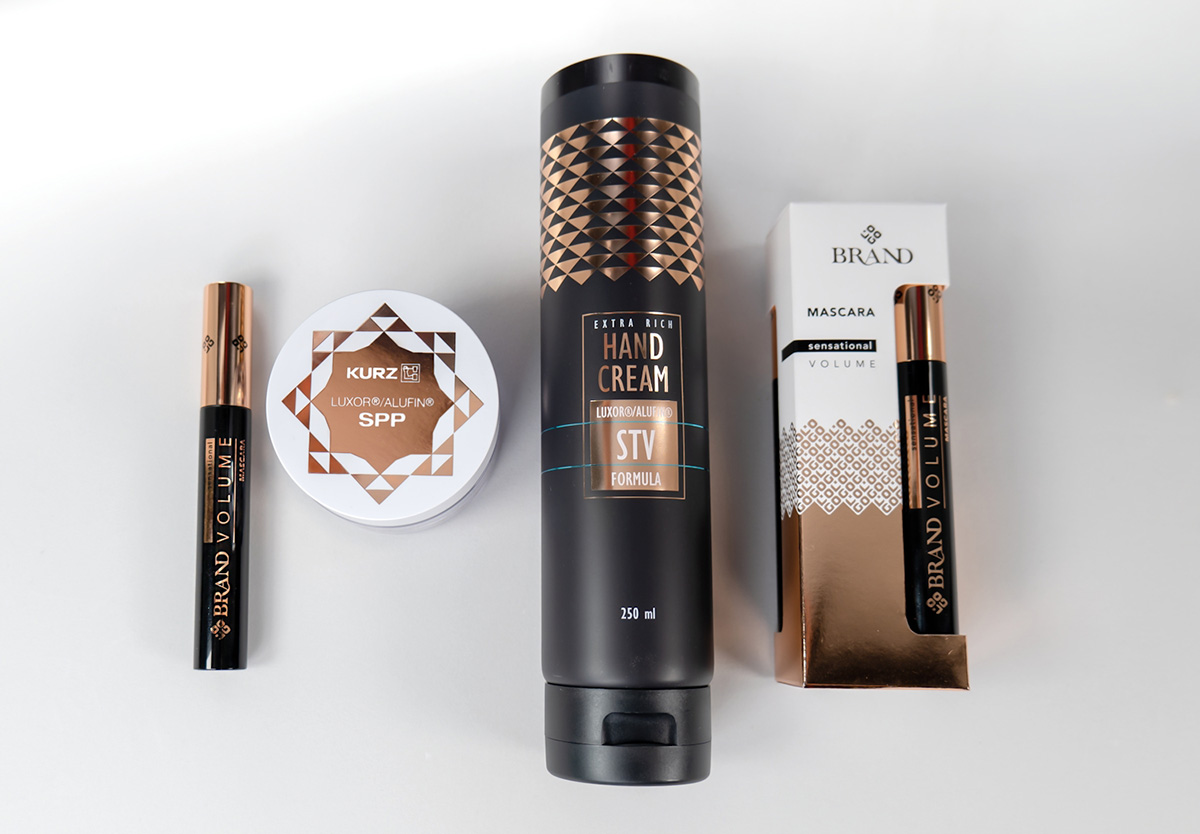 Luxury cosmetics packaging featuring metallic foil finishes on mascara, skincare and beauty product packaging.